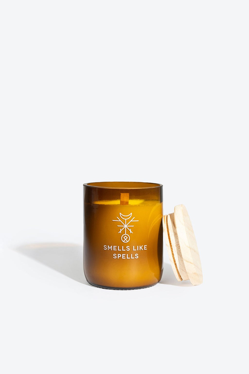 2. Smells Like Spells FRIGGA candle in amber glass jar with wooden lid, showcasing wooden wick and eco-friendly design