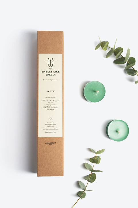 3. Smells Like Spells Scented Tealight Candles FREYR with green candles and eucalyptus, emphasizing eco-friendly packaging