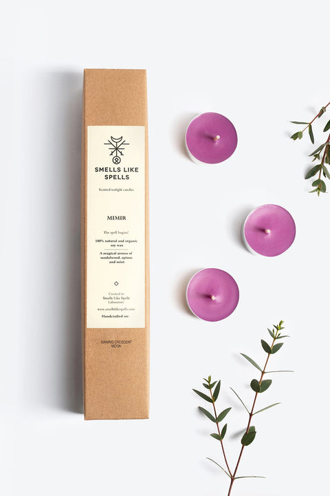 3. Smells Like Spells MIMIR purple tealight candles with packaging and foliage, emphasizing handcrafted soy wax and fragrance