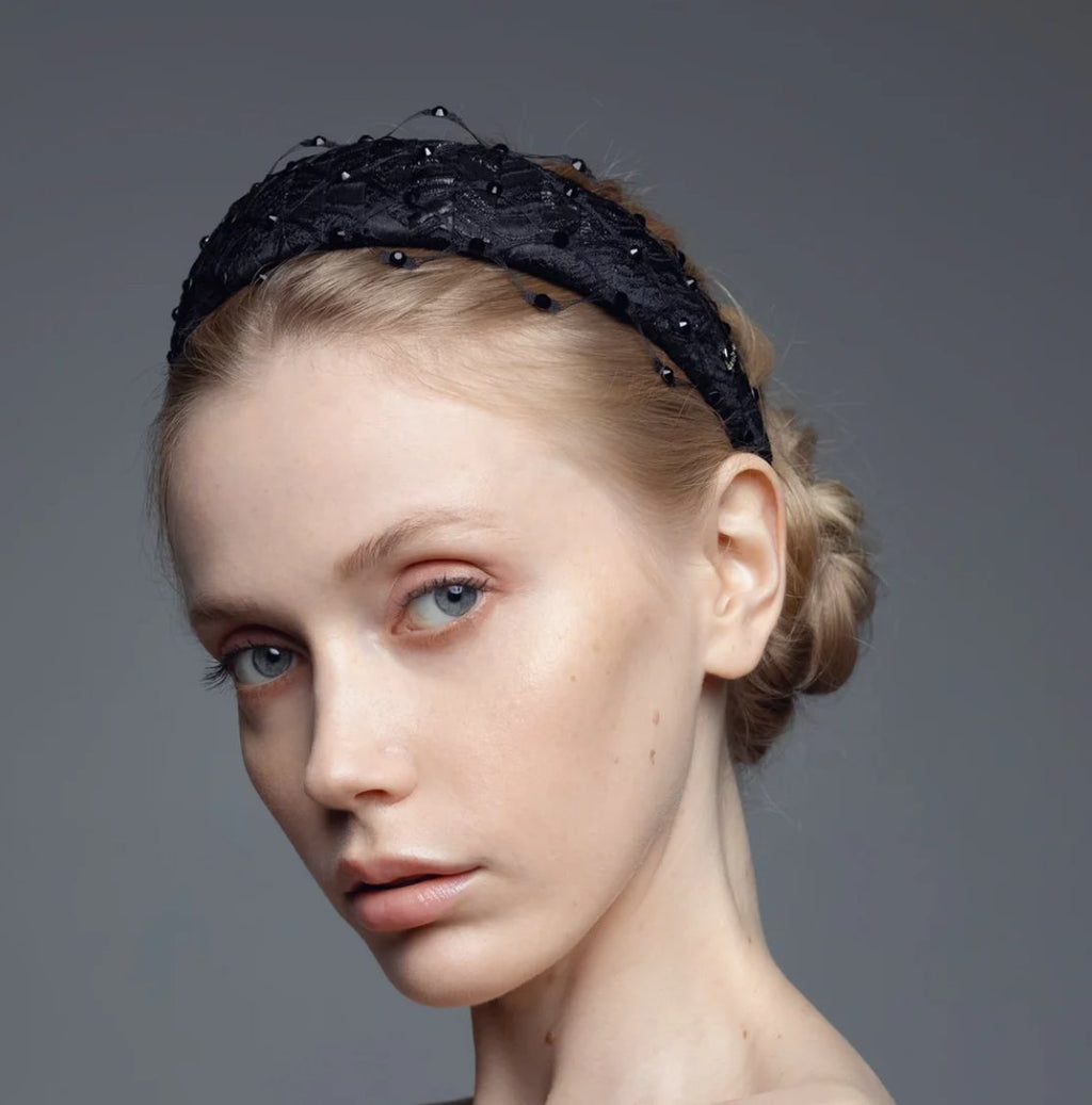 1. Women's Charlize headband with Swarovski crystals and honeycomb veil by Eva Oherjus, worn by model in studio