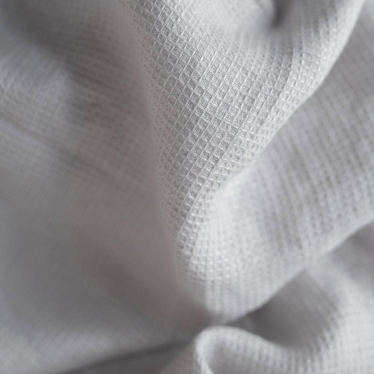 4. Close-up of silver linen fine waffle towel texture showing delicate weave