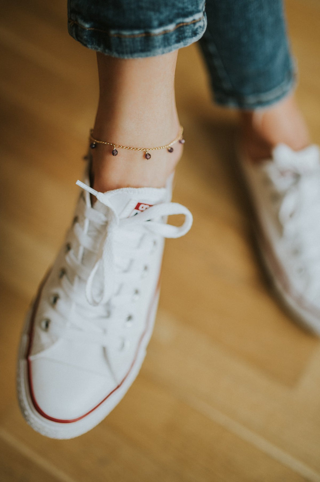 2. Lifestyle image of New Vintage by Kriss Anklet Eat, Pray, Love on woman's ankle with casual sneakers