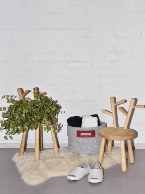 1. Wool Felt Omaking Basket in grey and bordeaux with leather handle, styled in a cozy home setting with wooden furniture and decor