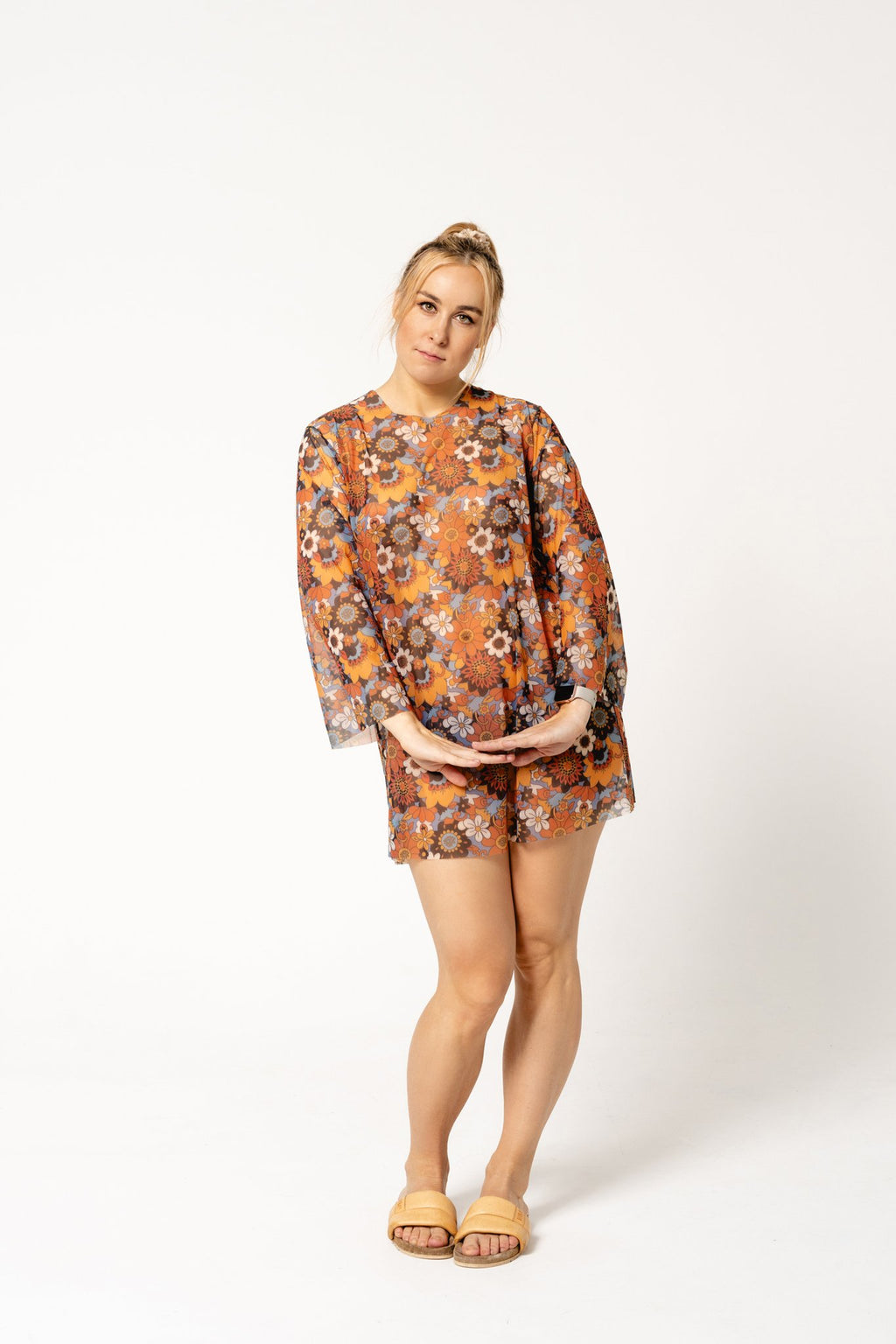 3. Women's Smarttan Kristel tunic in floral design, displayed by model in studio environment
