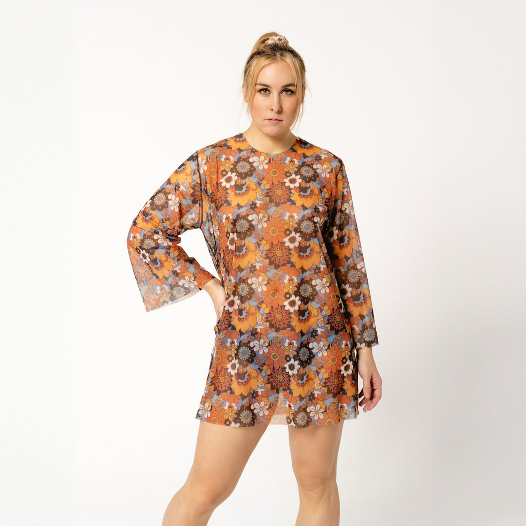 1. Women's tan-through tunic Kristel by Smarttan in floral pattern, worn by model in studio setting