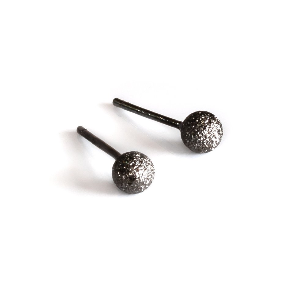3. Close-up of MyaMoon Sugarball Earrings in black plating, highlighting texture