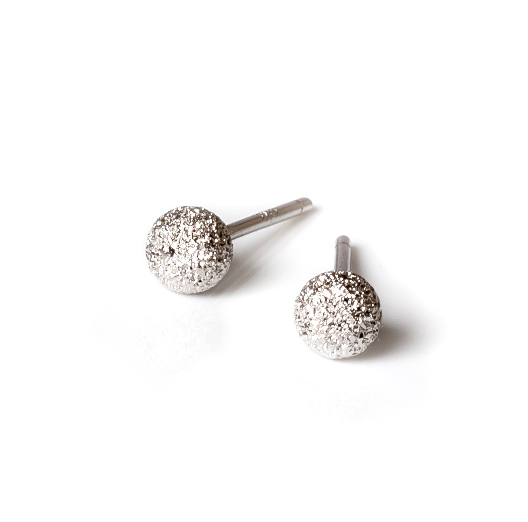 5. Close-up of MyaMoon Sugarball Earrings in silver plating, highlighting texture