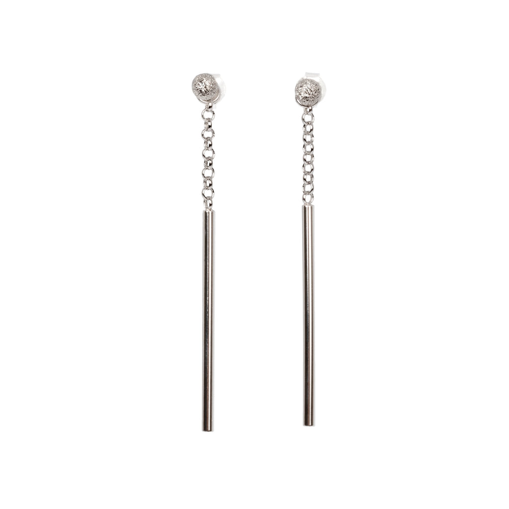 3. Studio image of MyaMoon Stardust Falling Earrings in silver with long drop and chain pendant