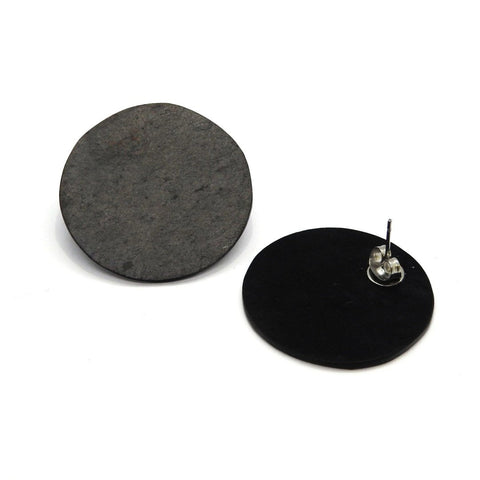 2. Pair of minimalist round earrings made from slate and marble by Seif Design, shown on a white background highlighting the natural texture and unique design