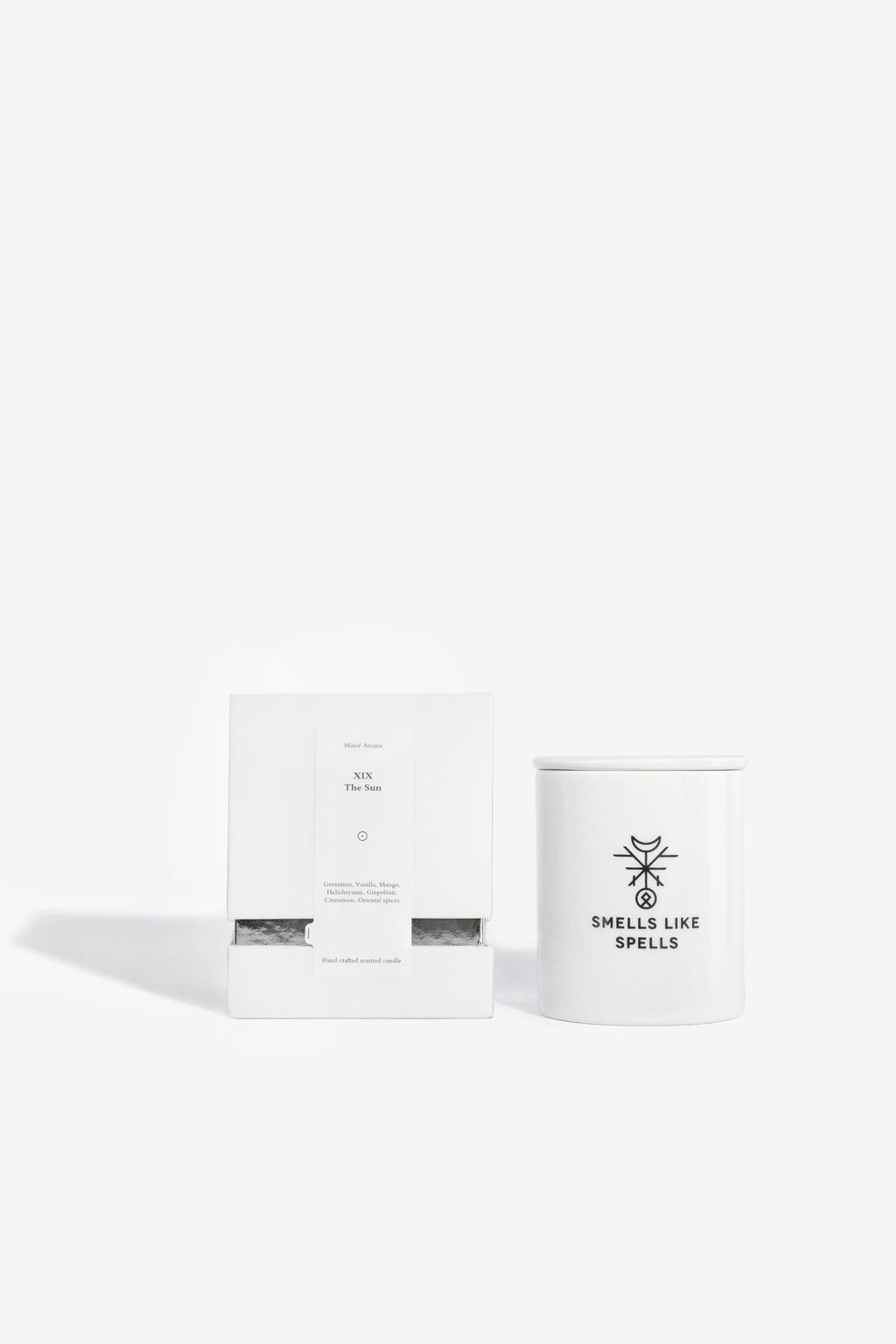 4. Smells Like Spells Scented Candle THE SUN with packaging, white porcelain container, studio setting
