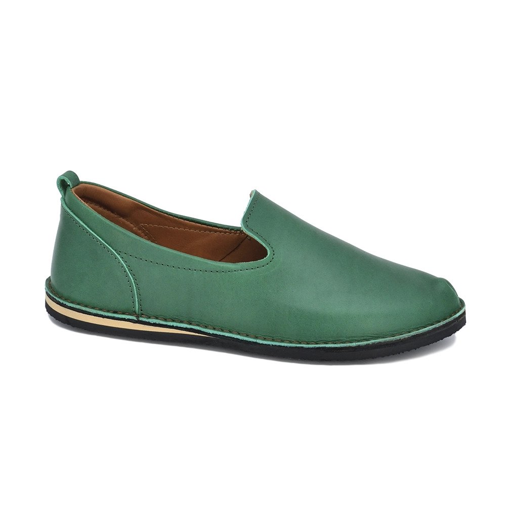 4. Side view of unisex green TOKU London shoe showing leather upper and flexible sole