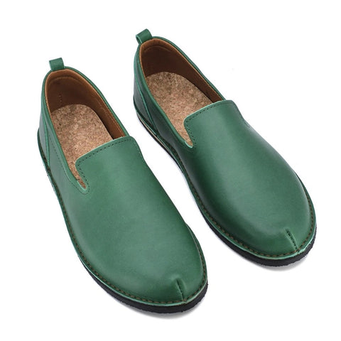 3. Studio image of unisex green TOKU London shoes with cork insole and leather upper