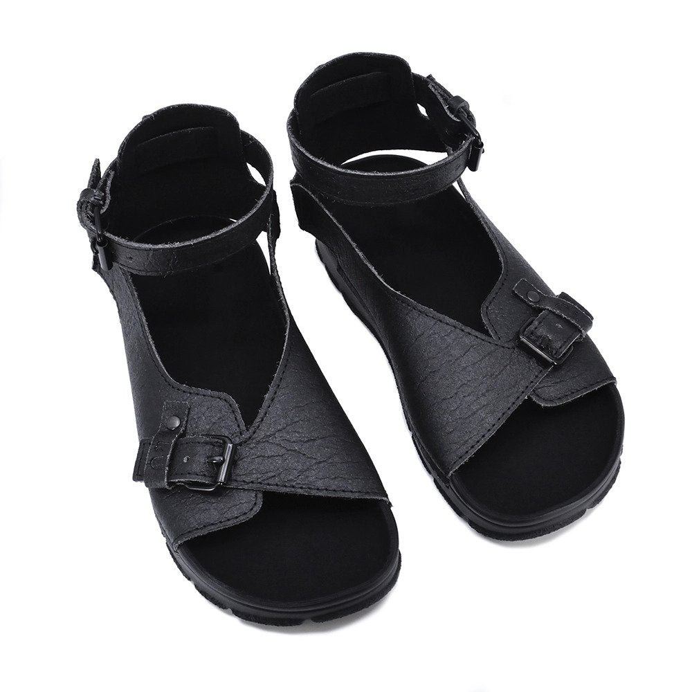 5. Pair of black TOKU Athens Vegan Sandals in studio, showing handcrafted design and buckles