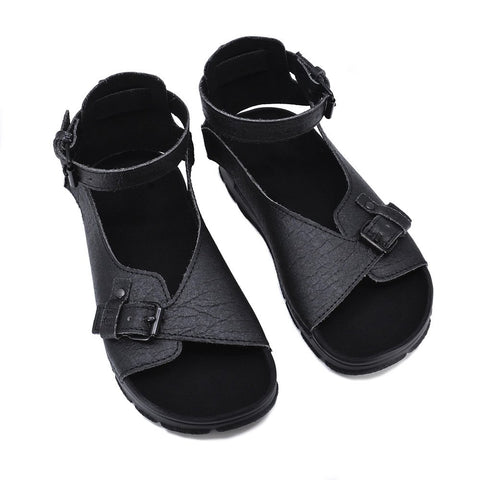 5. Pair of black TOKU Athens Vegan Sandals in studio, showing handcrafted design and buckles