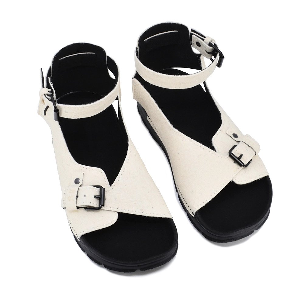 2. Studio image of TOKU Athens Vegan Sandals in white, showing adjustable ankle strap and closed heel