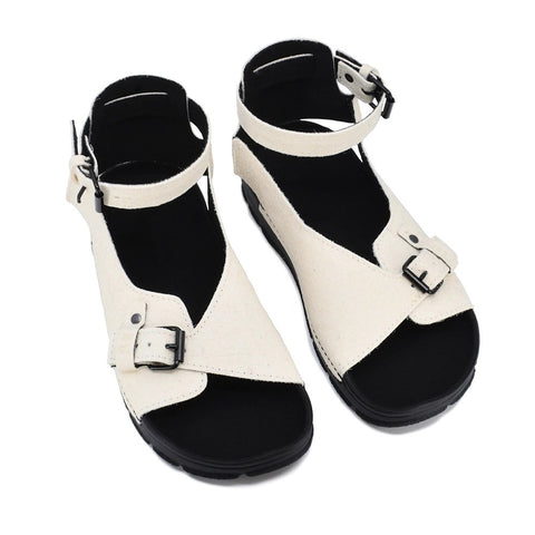 2. Studio image of TOKU Athens Vegan Sandals in white, showing adjustable ankle strap and closed heel