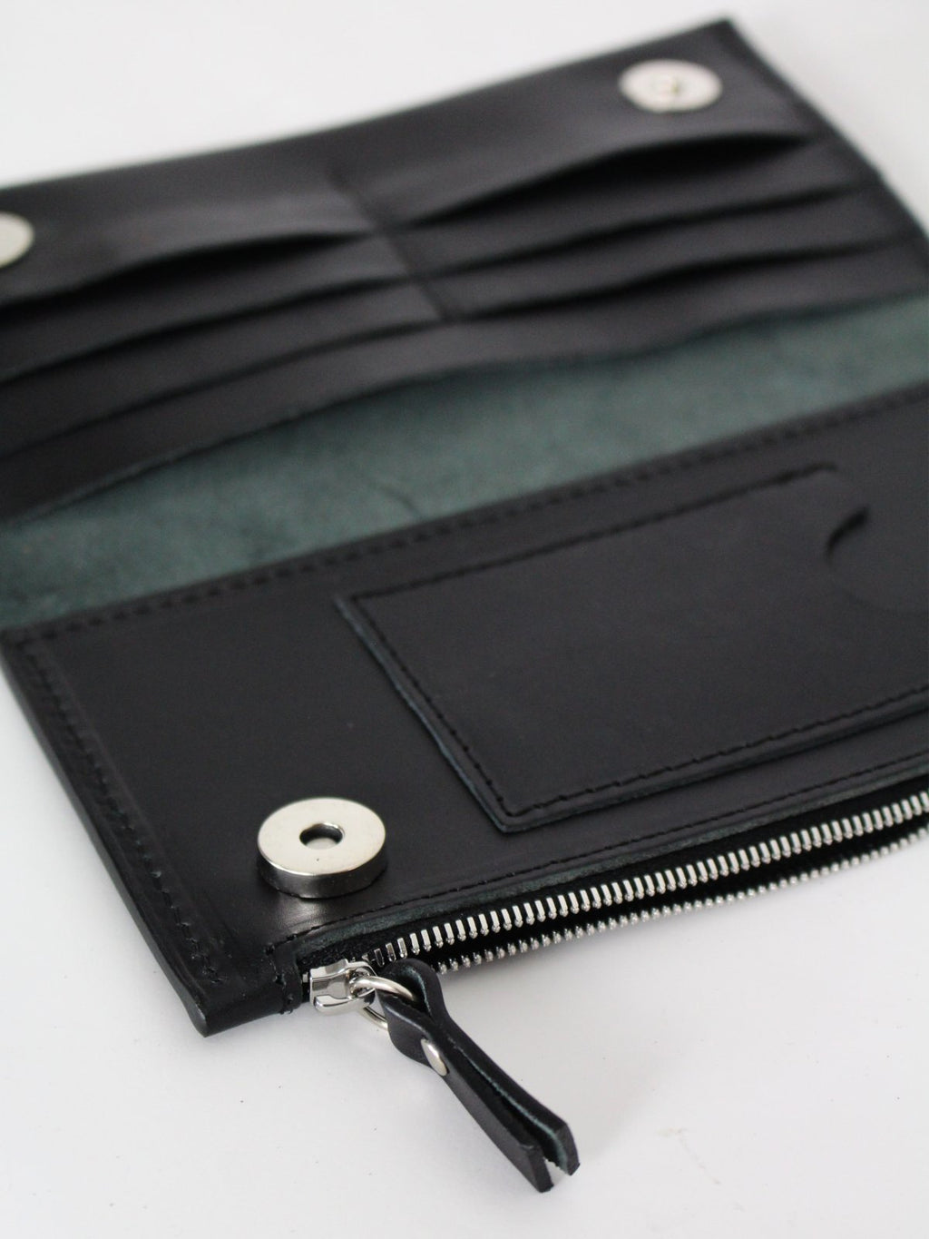 2. Interior view of black Lava flow Classic Leather Wallet TAAL, showing card compartments and zippered section