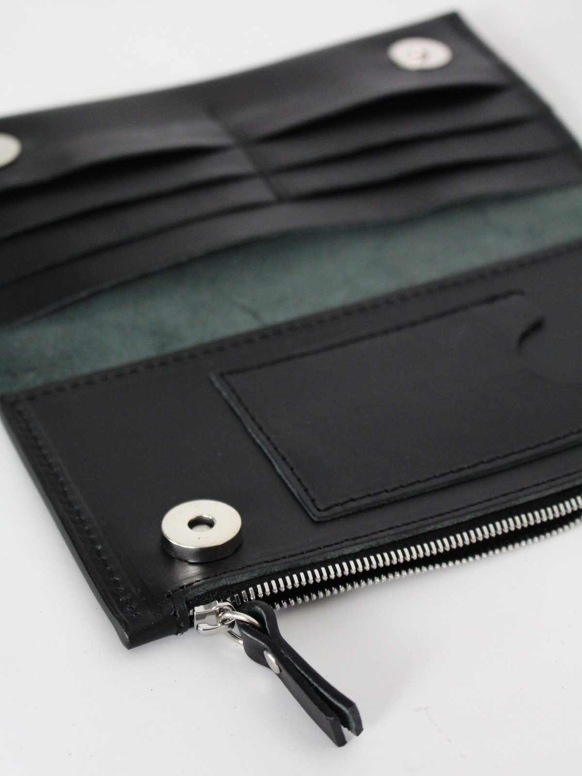 2. Interior view of black Lava flow Classic Leather Wallet TAAL, showing card compartments and zippered section