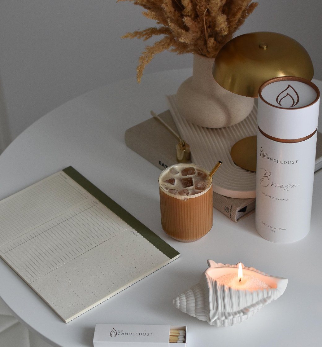 3. Two Candledust Diamond Dust powdered candles in textured glass holders on a wooden desk