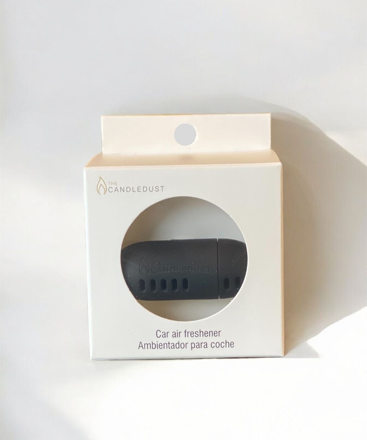 5. Candledust Champagne Rhubarb car diffuser in packaging, highlighting product branding and design