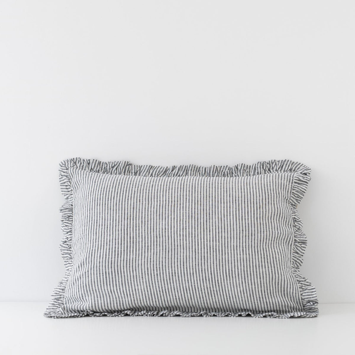 3. Black and white striped linen pillowcase with frills on a plain white background