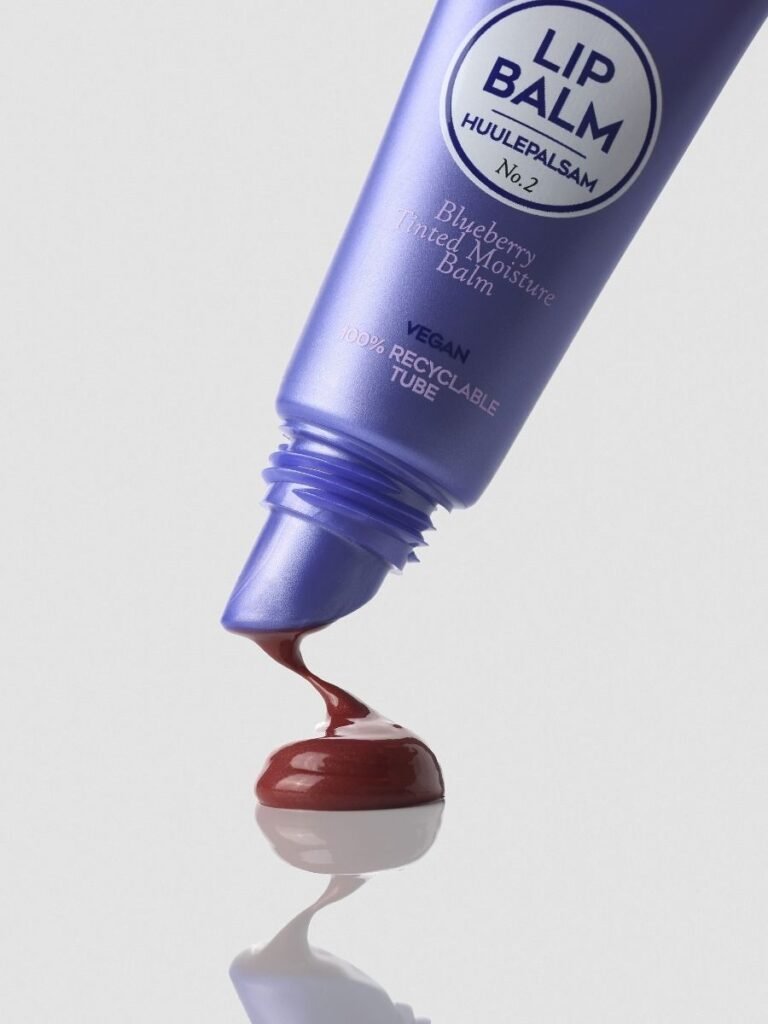 3. Magrada Organic Cosmetics Blueberry Tinted Lip Balm tube with product oozing out, highlighting glossy berry hue