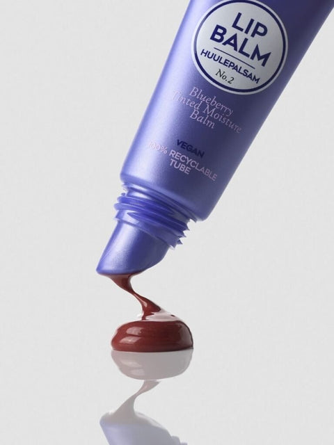 3. Magrada Organic Cosmetics Blueberry Tinted Lip Balm tube with product oozing out, highlighting glossy berry hue