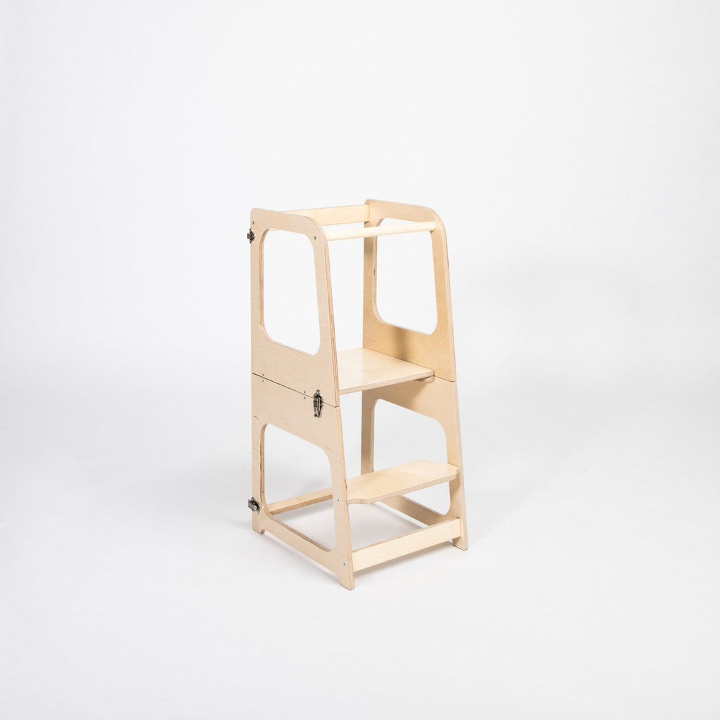 11. Natural wood transformable kitchen tower in step stool configuration on white background