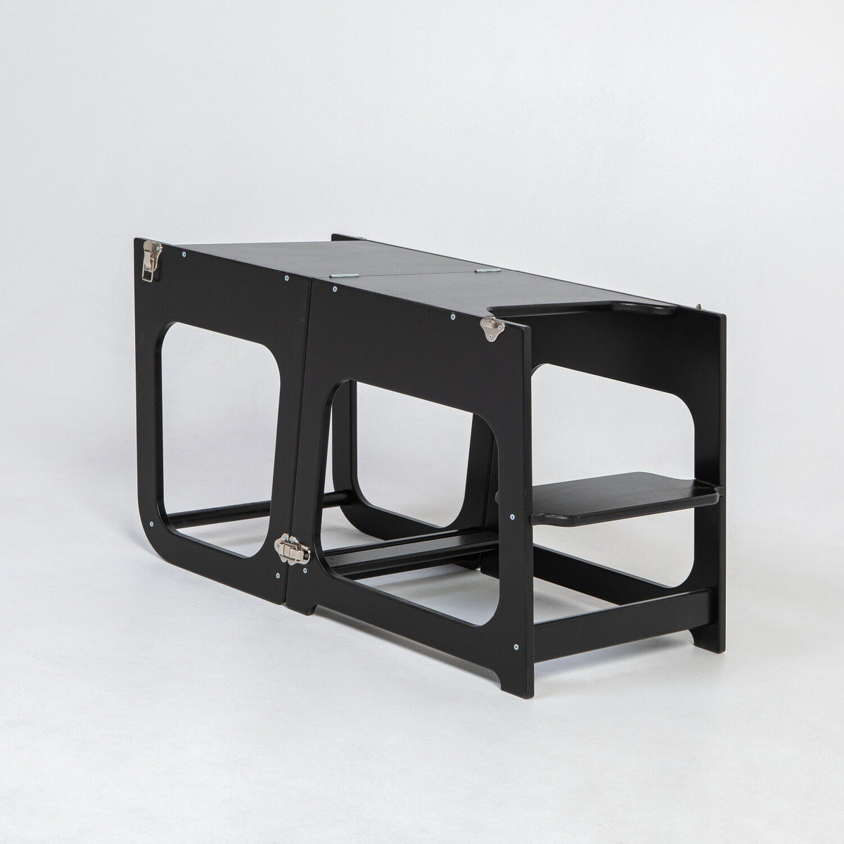 7. Black transformable kitchen tower in table configuration on white background