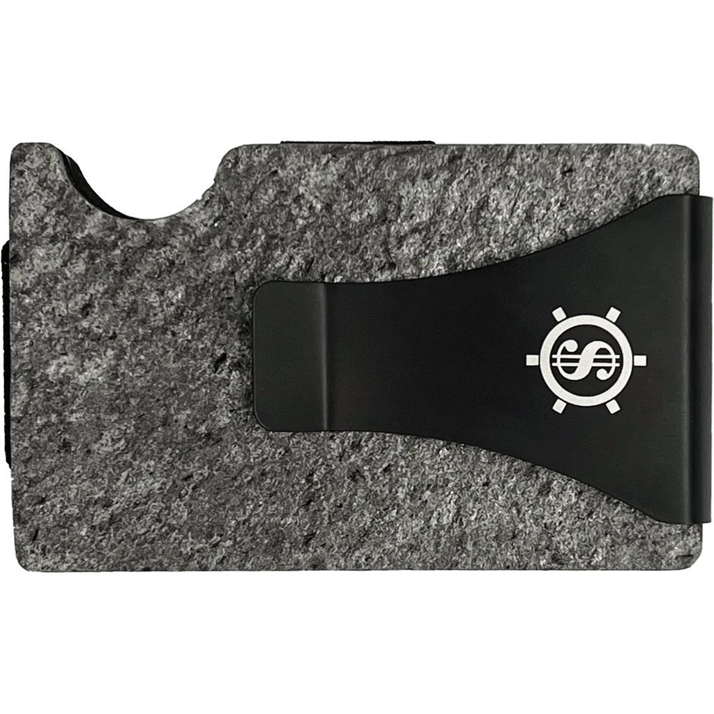 3. Close-up of Tume Kask cardholder with black money clip featuring logo on slate stone