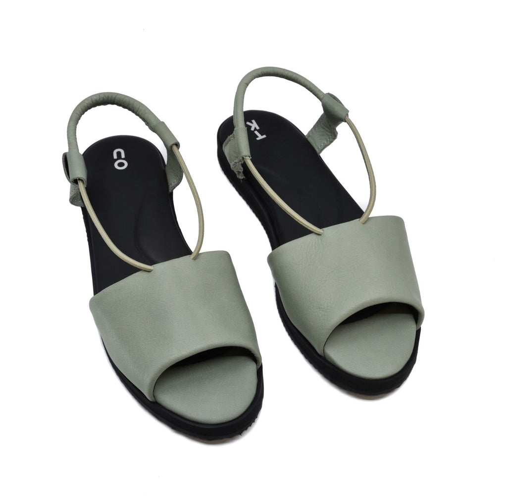 5. Pair of green Berlin sandals by Omaking, highlighting the leather upper and ergonomic insole