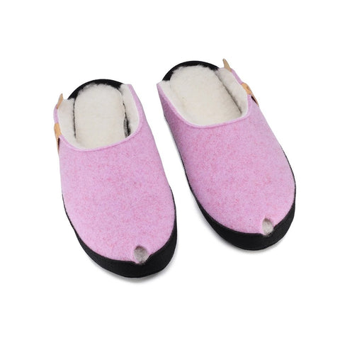 2. Studio image of TOKU Brussels slippers in light pink with lambswool lining and black sole