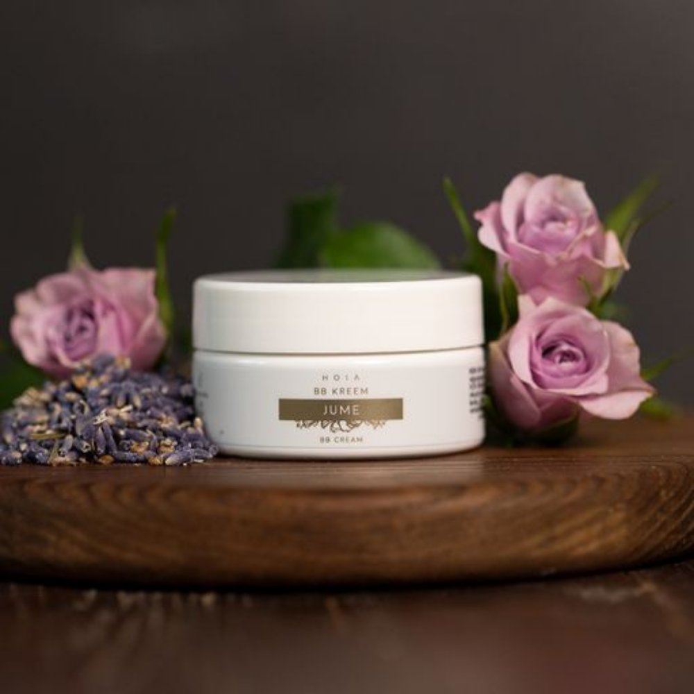 1. HOIA homespa BB Cream in open jar showing creamy texture, held in hand