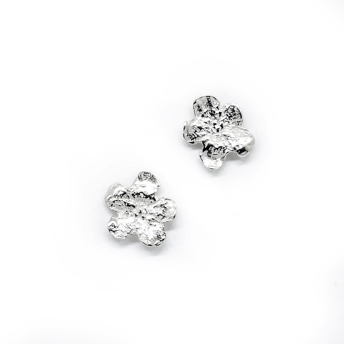 4. Silver-plated SPRING Forget-Me-Not earrings by Agnes Veski Jewellery, made from 925 silver, shown in studio