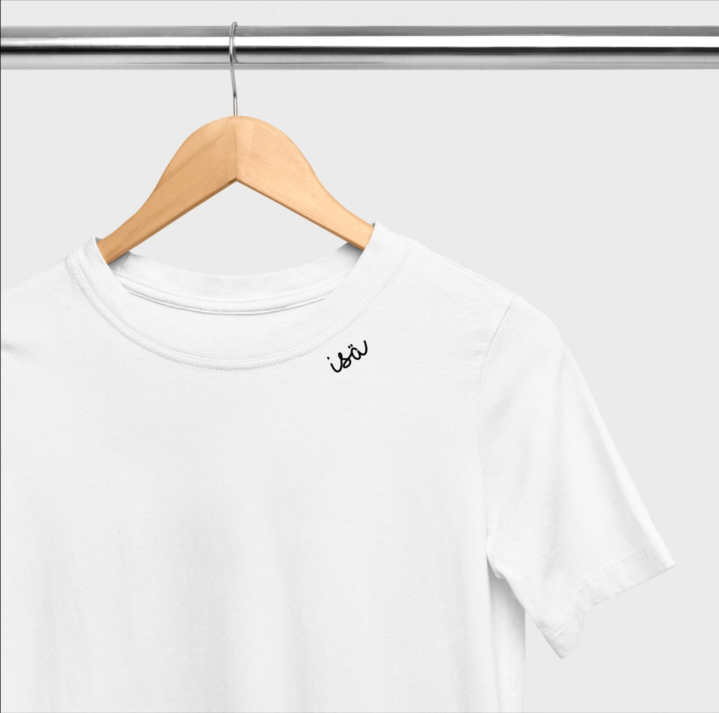 3. White unisex organic cotton t-shirt with embroidered collar by Beebila, displayed on a hanger