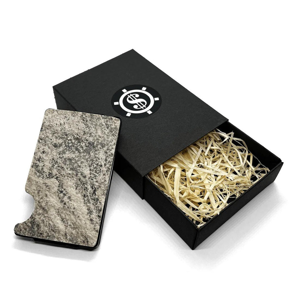 2. Mere Marmor cardholder with natural marble design, displayed with open eco-friendly packaging and straw filling