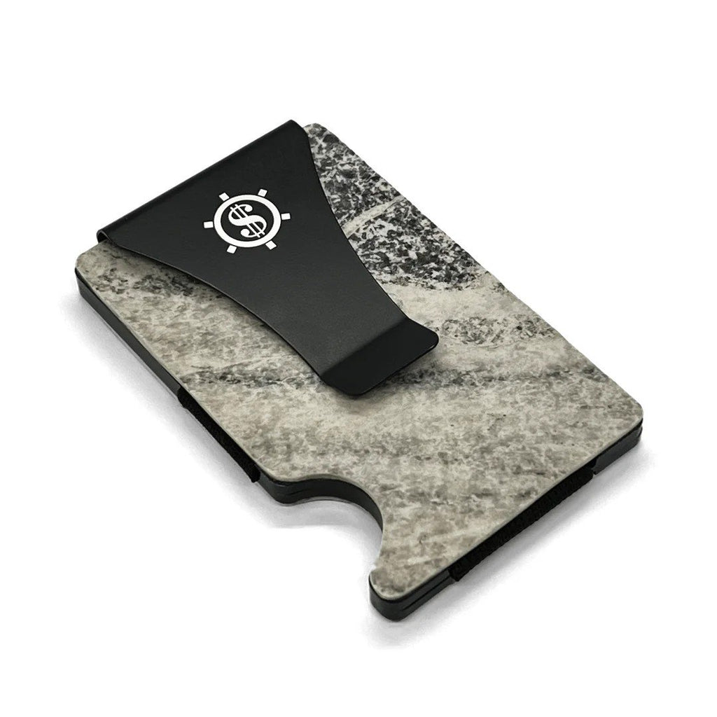 3. Close-up of Mere Marmor cardholder with black money clip and natural marble texture, highlighting Seif Design logo