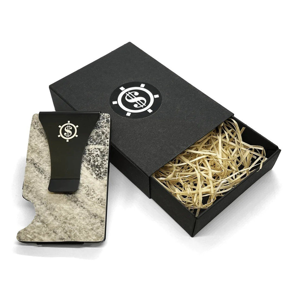 1. Mere Marmor cardholder with black money clip and natural marble design, shown with eco-friendly packaging featuring straw filling and Seif Design logo