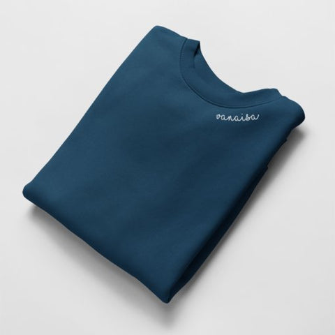 4. Navy Vanaisa sweatshirt by Beebila with embroidered collar, folded in studio setting
