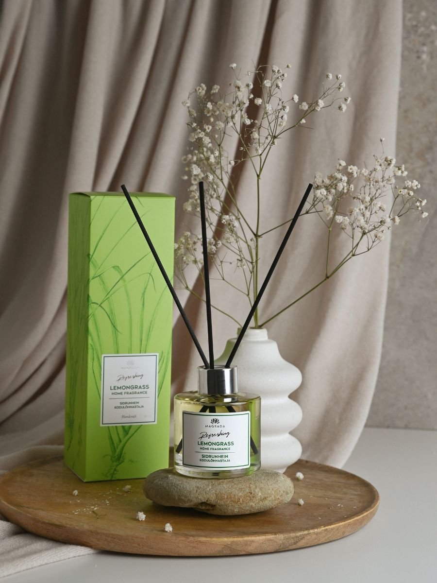 1. Magrada Organic Cosmetics home fragrance with lemongrass scent, featuring natural reed sticks, displayed with packaging in a serene setting
