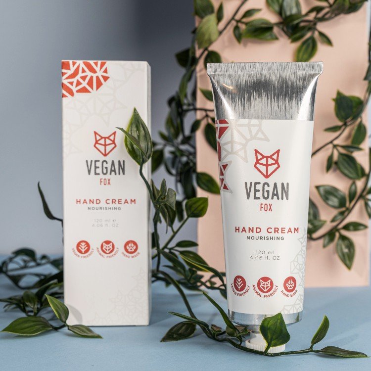 6. Vegan Fox Nourishing Hand Cream with Shea Butter, 120 ml, displayed with packaging and green leaves in lifestyle setting