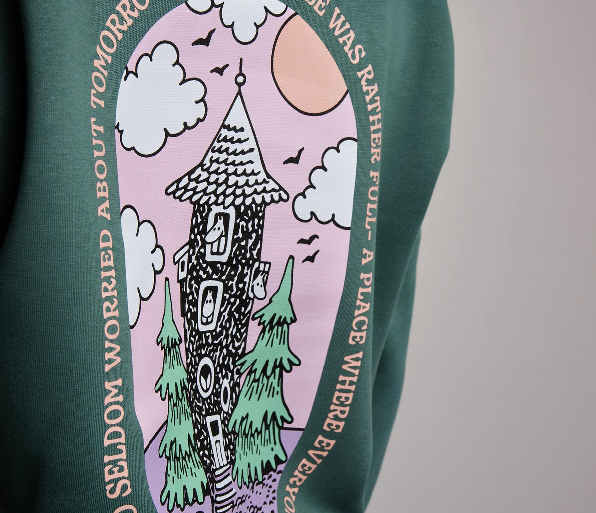 4. Close-up of Moominhouse design on back of green Moomin by NordicBuddies hoodie
