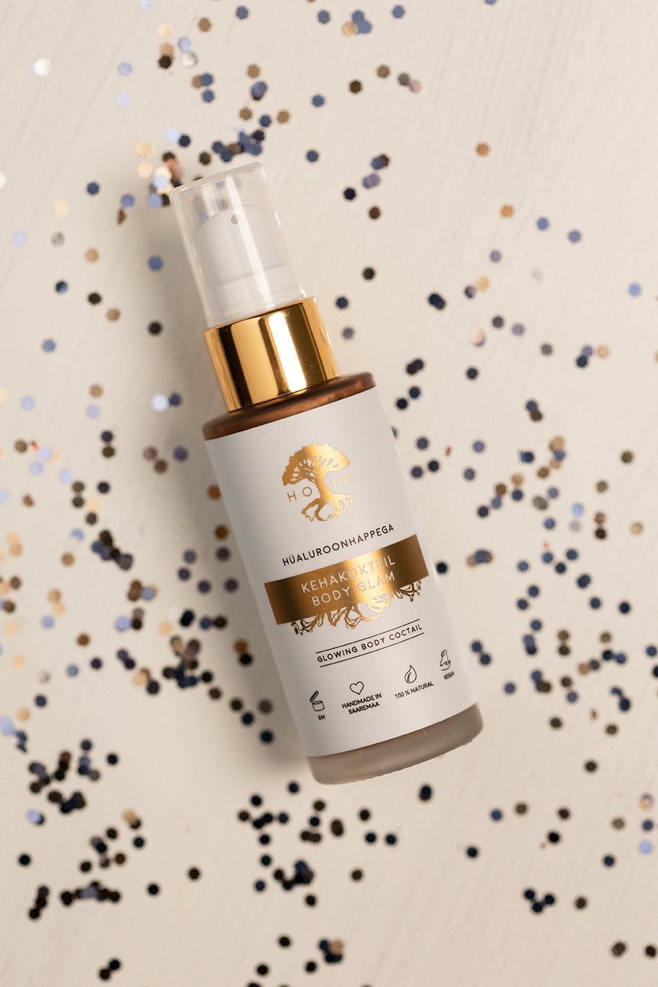 7. HOIA homespa Body Cocktail Body Glam bottle on white background with confetti, showcasing product design