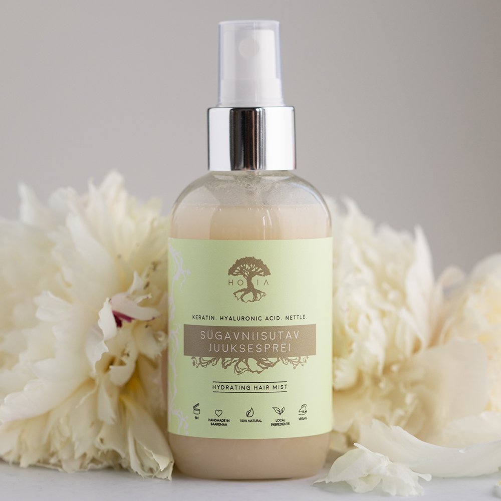 1. HOIA homespa Deep Moisturising Hair Spray 100ml with nettle and hyaluronic acid, shown with white flowers