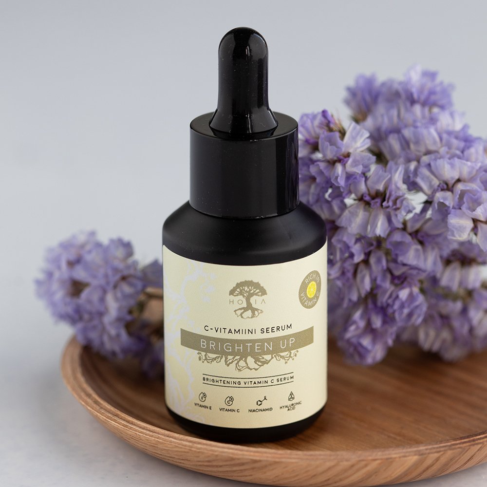 1. HOIA homespa Brightening Vitamin C Serum, 30ml bottle with dropper, displayed with purple flowers