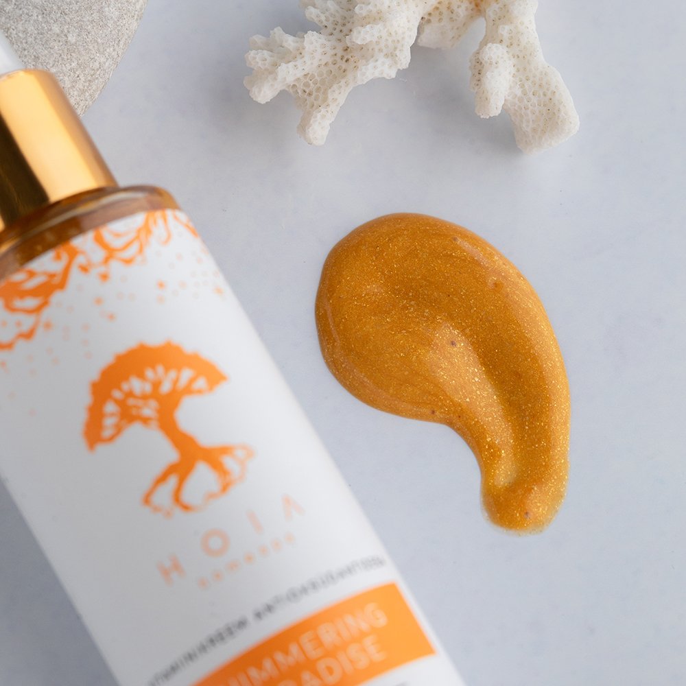 2. Close-up of HOIA homespa Shimmering Paradise Body Cream showing golden shimmer texture