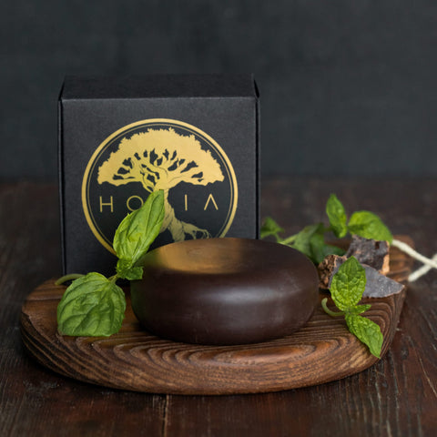 1. HOIA homespa Body Chocolate with Peppermint displayed with fresh mint leaves on a wooden board