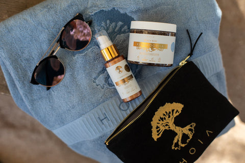 1. HOIA homespa Anti-Cellulite Body Scrub Beach Bum displayed with sunglasses and towel in a lifestyle setting