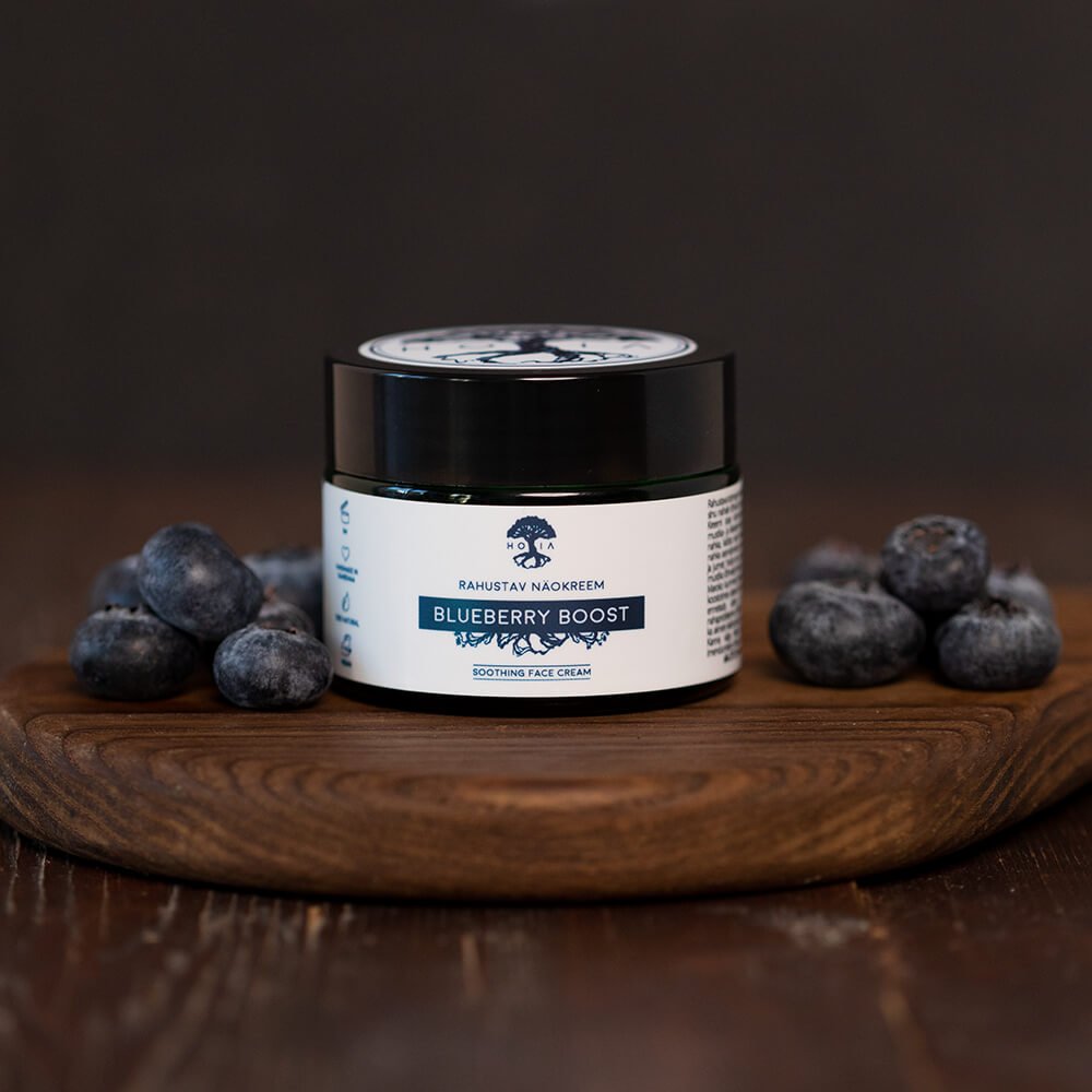 3. HOIA homespa Soothing Face Cream Blueberry Boost jar on wooden board with fresh blueberries, highlighting natural ingredients
