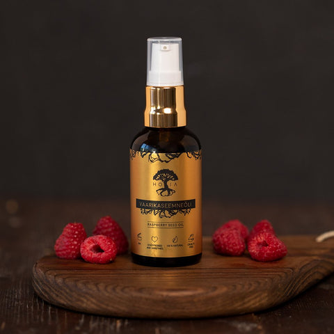 1. HOIA homespa Raspberry Seed Oil bottle on wooden board with fresh raspberries, highlighting natural skincare benefits